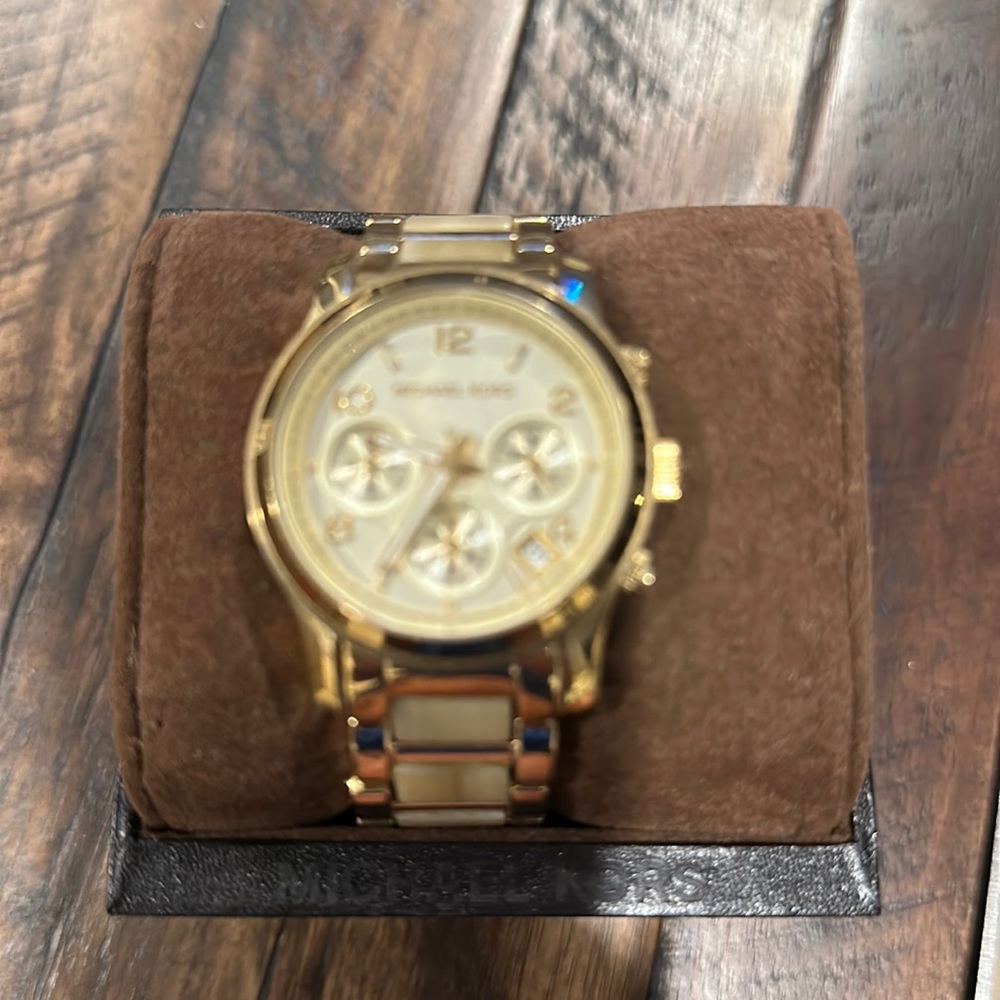 Michael Kors. Gold, women’s watch.  Needs battery.